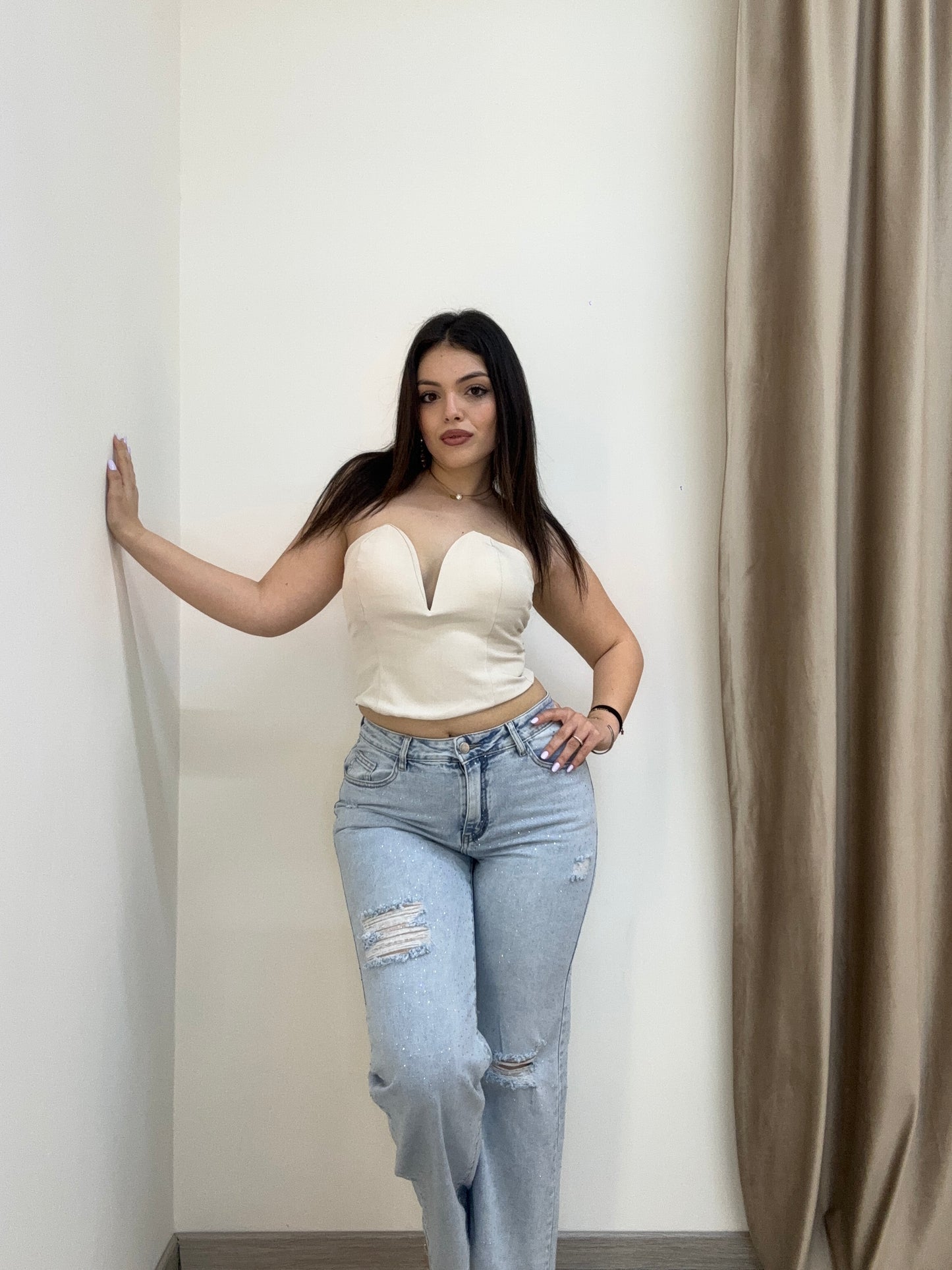 Jeans brillantinato con strappi