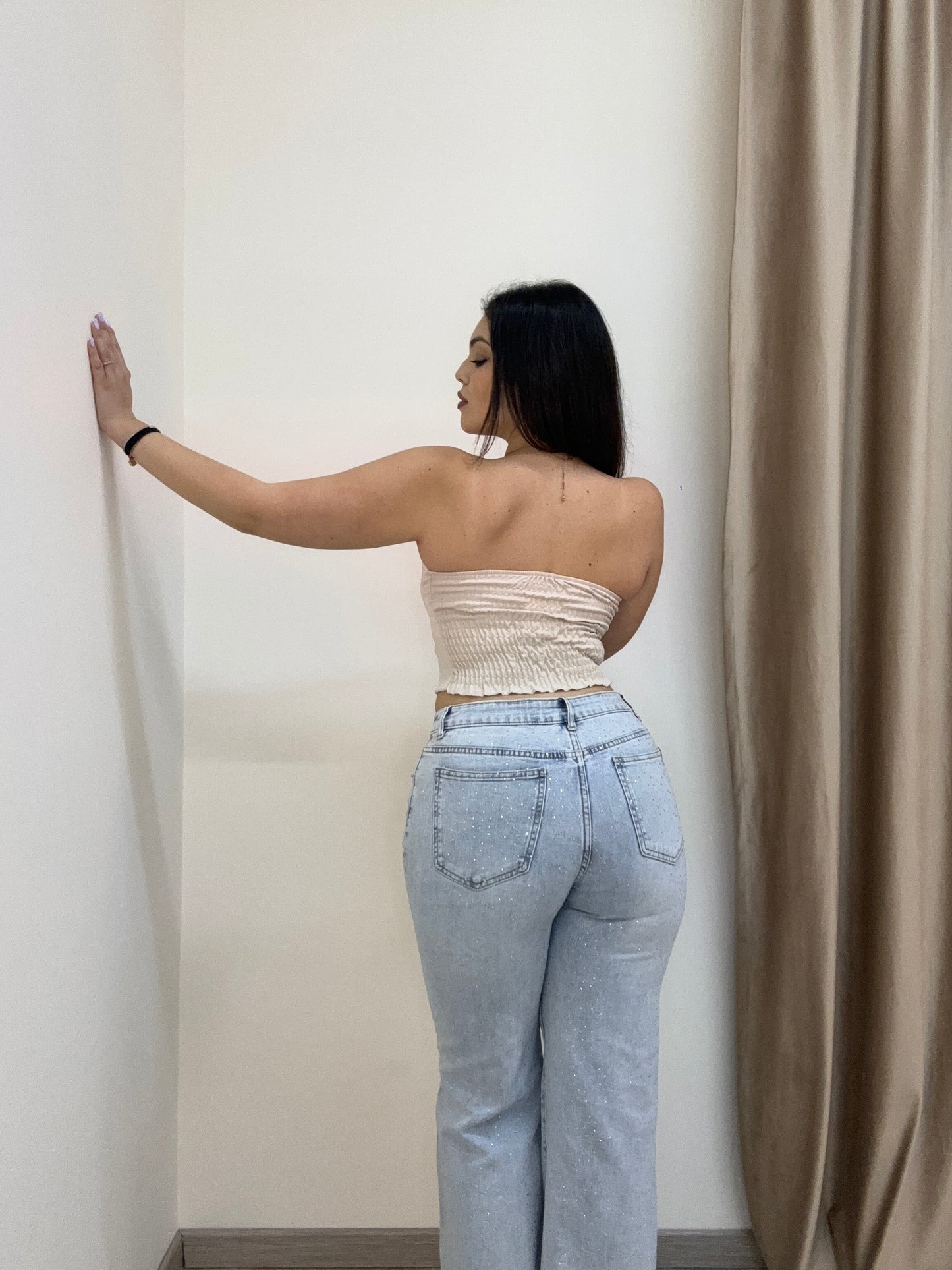 Jeans brillantinato con strappi